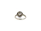 a close up of a ring with a diamond on it