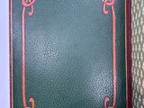 an open book with a celtic design on the cover