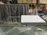 a laptop computer sitting on top of a glass table