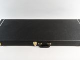 a black case with gold handles on a white background