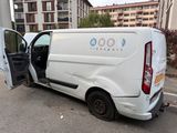 a white van with the door open in a parking lot