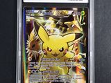 a close up of a pokemon card in a plastic case