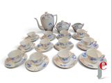 a picture of a collection of porcelain tea and coffee sets