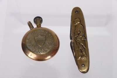 two antique brass pocket watches and a brass pocket watch on a white surface