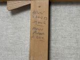a wooden cross with writing on it on the floor