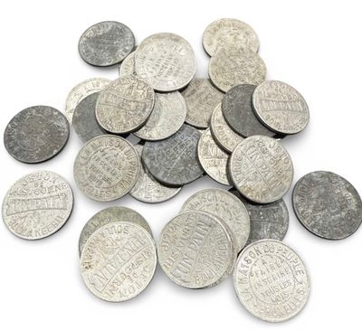 pile of silver coins on a white background