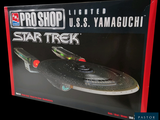 a box with a model of a star trek ship on it