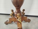 a wooden table with a vase on top of it