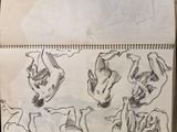 a bunch of drawings on a piece of paper on a table