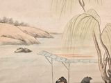 two people sitting on a boat in the water