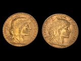 two gold sovereigns, one of which has a head of a woman and the other of a man