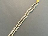 a close up of a beaded bracelet on a table