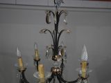 a chandelier hanging from the ceiling in a room