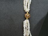 a close up of a necklace on a mannequin mannequin mannequin mannequin mannequin mannequin mannequin mannequin