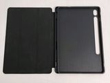 a close up of a black case with a pen in it