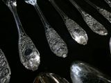 a lot of spoons that are sitting on a table
