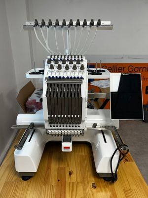 a machine that is sitting on top of a wooden table