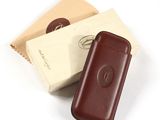 leather case for a cell phone in a box on a white surface