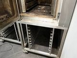 an image of an open oven door in a kitchen
