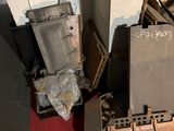 a pile of old appliances sitting on the floor in a room