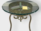a glass table with a metal base and a glass top