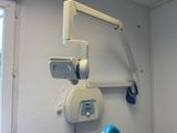 an image of a hospital room with a chair and a monitor