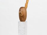 an image of a sculpture of a bird sitting on top of a block