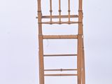 a wooden chair that has a ladder on the back of it