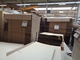 a large amount of cardboard stacked on top of each other