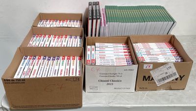 several boxes of dvds are stacked on a table in a room