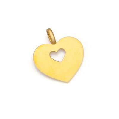 a gold heart pendant with a cutout in the middle