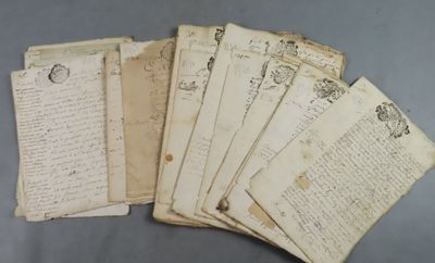 a bunch of old papers sitting on top of a table