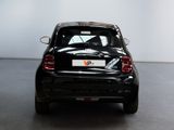 a small black car that is parked in a room