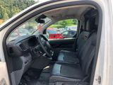 the interior of a car with the door open and the driver ' s seat down