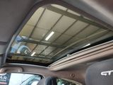 a view of the inside of a car with the sunroof