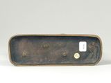 a bronze sculpture of a man on a skateboard