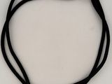 a close up of a black cord bracelet with a silver clasp