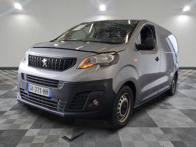 a silver van that is parked on a checkered floor