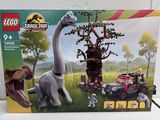 a box with a toy dinosaur and a toy car in it