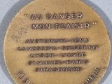 an image of a gold medal with a message on it