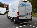 two vans parked in a parking lot next to each other