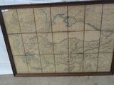 un vieux cadre de carte sur lequel figure une carte des États-Unis