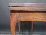 a small wooden table with a drawer on top of it