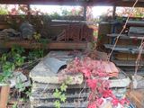a pile of bricks and a pile of leaves in a yard