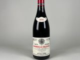 a close up of a bottle of wine on a table