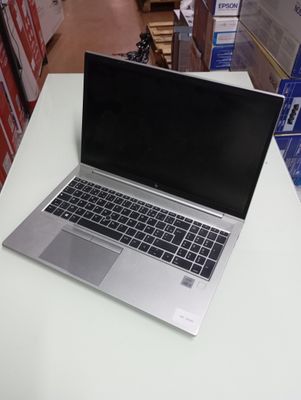 a laptop computer sitting on a table in a store