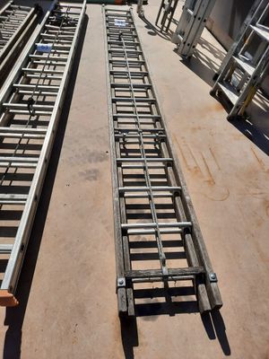 two ladders that are sitting on the ground
