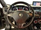 the interior of a car with a steering wheel and dashboard controls