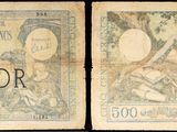 Trois types de devises différents sont représentés sur une feuille de papier