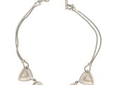 a silver bracelet with five hearts on a string